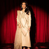 Beige raw silk outfit with emerald embroidery and zardosi detailing.
