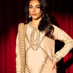 Beige raw silk outfit with emerald embroidery and zardosi detailing.