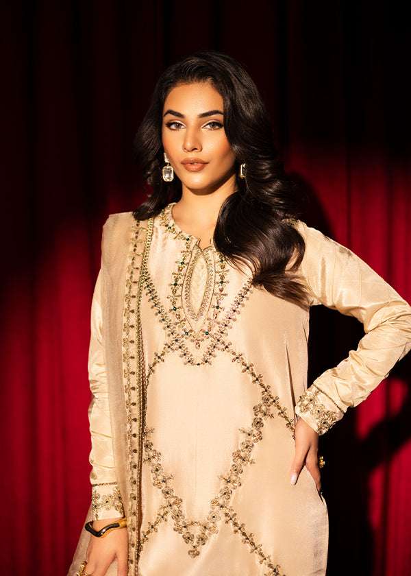 Beige raw silk outfit with emerald embroidery and zardosi detailing.