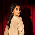 Beige raw silk outfit with emerald embroidery and zardosi detailing.