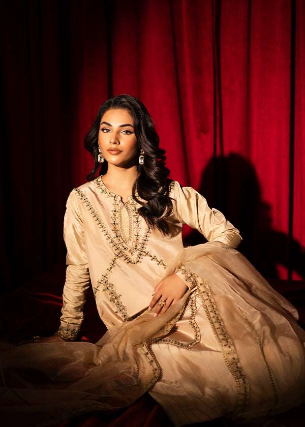 Beige raw silk outfit with emerald embroidery and zardosi detailing.