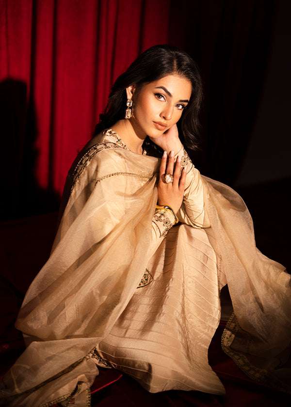 Beige raw silk outfit with emerald embroidery and zardosi detailing.