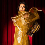 Olive green raw silk outfit with hand-done zardosi, Swarovski embellishments, and an embroidered organza dupatta.