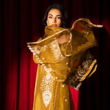 Olive green raw silk outfit with hand-done zardosi, Swarovski embellishments, and an embroidered organza dupatta.