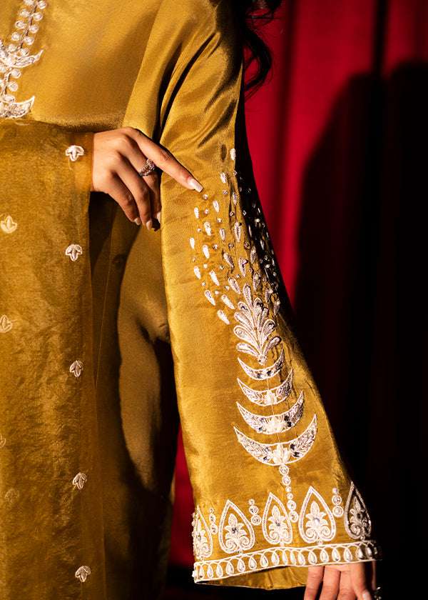 Olive green raw silk outfit with hand-done zardosi, Swarovski embellishments, and an embroidered organza dupatta.
