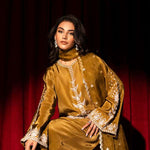 Olive green raw silk outfit with hand-done zardosi, Swarovski embellishments, and an embroidered organza dupatta.