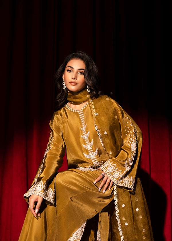 Olive green raw silk outfit with hand-done zardosi, Swarovski embellishments, and an embroidered organza dupatta.