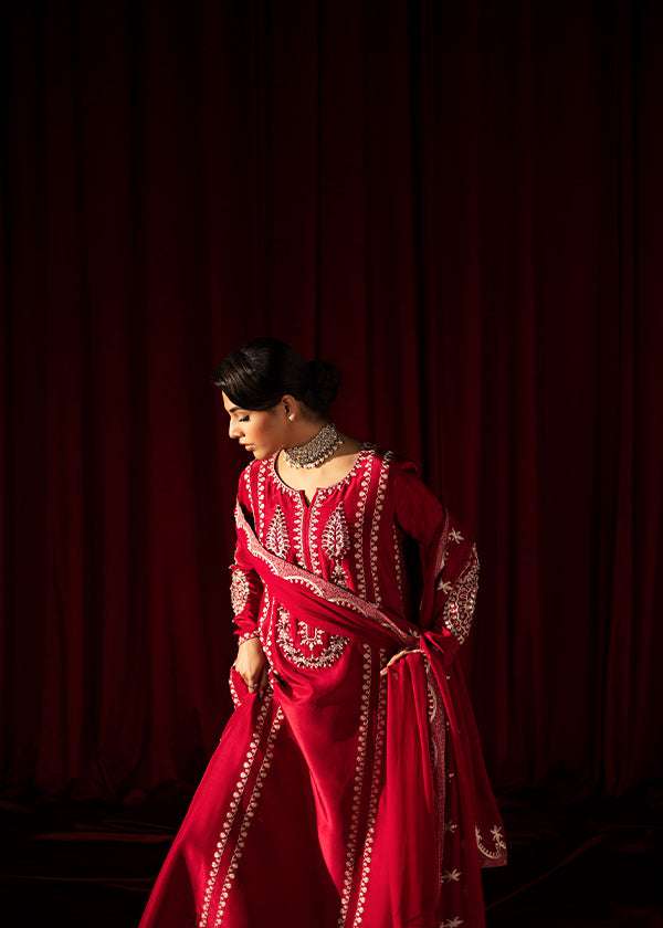 Buy Pink-Mavis raw silk kalidar dress online, featuring hand-embellished red & silver crystals, dabka work, scalloped hemline, embroidered chiffon dupatta, and tailored cigarette pants.