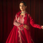 Buy Pink-Mavis raw silk kalidar dress online, featuring hand-embellished red & silver crystals, dabka work, scalloped hemline, embroidered chiffon dupatta, and tailored cigarette pants.