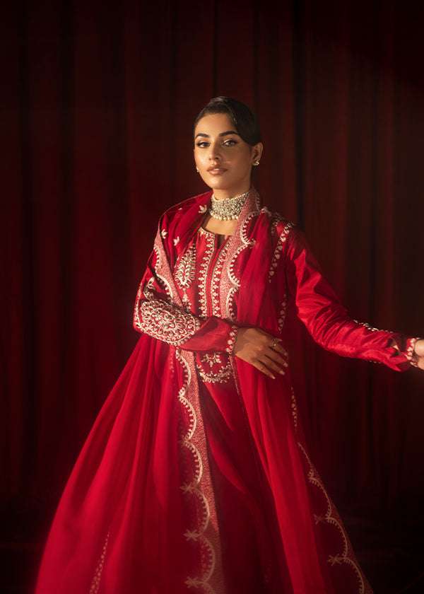 Buy Pink-Mavis raw silk kalidar dress online, featuring hand-embellished red & silver crystals, dabka work, scalloped hemline, embroidered chiffon dupatta, and tailored cigarette pants.