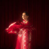 Buy Pink-Mavis raw silk kalidar dress online, featuring hand-embellished red & silver crystals, dabka work, scalloped hemline, embroidered chiffon dupatta, and tailored cigarette pants.