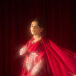 Buy Pink-Mavis raw silk kalidar dress online, featuring hand-embellished red & silver crystals, dabka work, scalloped hemline, embroidered chiffon dupatta, and tailored cigarette pants.