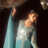 Teal organza outfit with hand-embellished Swarovski crystals, sheer organza dupatta, and raw silk pants.