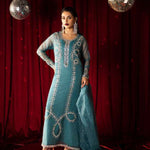 Teal organza outfit with hand-embellished Swarovski crystals, sheer organza dupatta, and raw silk pants.