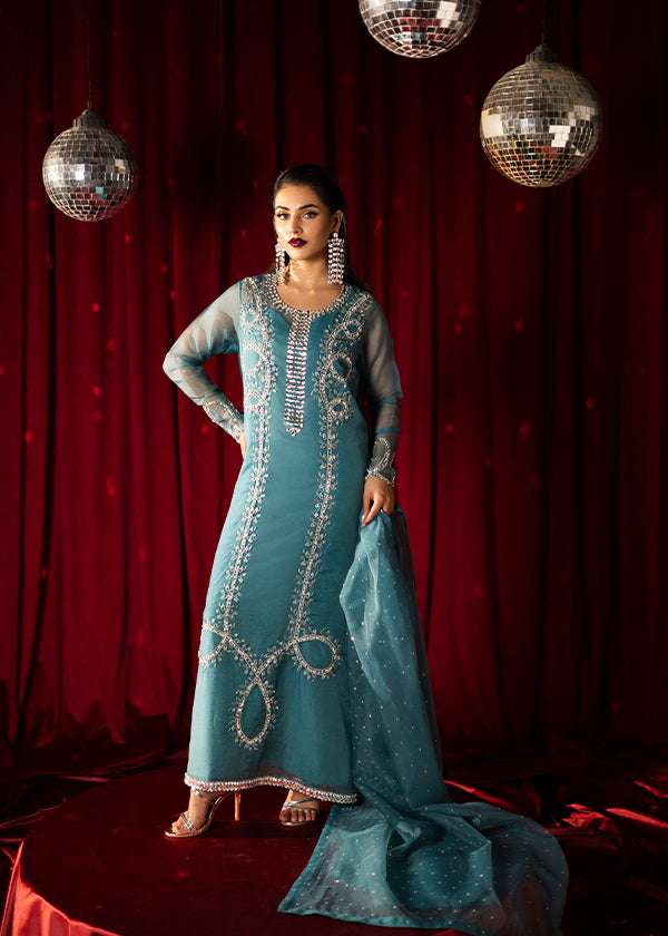 Teal organza outfit with hand-embellished Swarovski crystals, sheer organza dupatta, and raw silk pants.