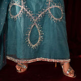 Teal organza outfit with hand-embellished Swarovski crystals, sheer organza dupatta, and raw silk pants.