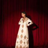White raw silk kaftan with zardosi, sequins, and beadwork.