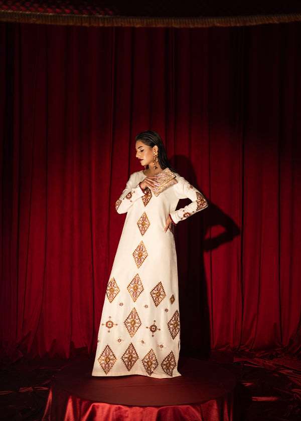 White raw silk kaftan with zardosi, sequins, and beadwork.