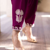 Magenta straight-cut embroidered shirt with delicate powder pink motifs, paired with a sleek skinny shalwar from COCO.