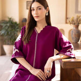 Magenta straight-cut embroidered shirt with delicate powder pink motifs, paired with a sleek skinny shalwar from COCO.