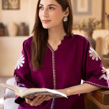 Magenta straight-cut embroidered shirt with delicate powder pink motifs, paired with a sleek skinny shalwar from COCO.