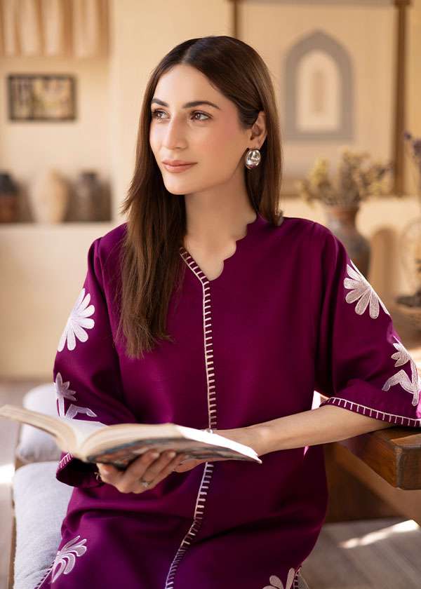 Magenta straight-cut embroidered shirt with delicate powder pink motifs, paired with a sleek skinny shalwar from COCO.