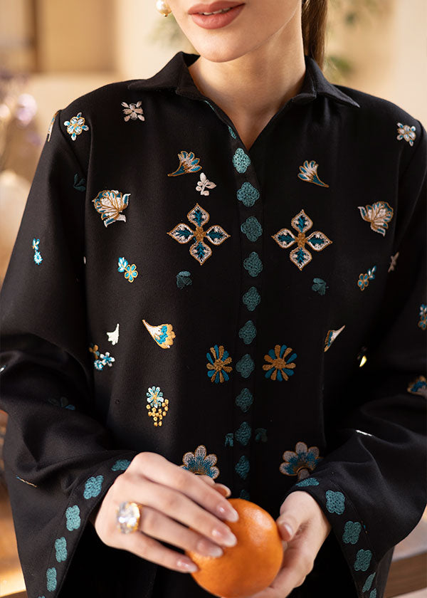 Buy a Noire black embroidered outfit online featuring a sleek collared neckline, intricate turquoise embroidery, and tailored straight pants for a refined look.
