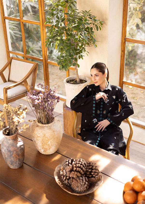 Buy a Noire black embroidered outfit online featuring a sleek collared neckline, intricate turquoise embroidery, and tailored straight pants for a refined look.