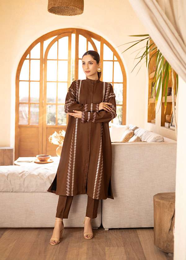 Buy a brown embroidered outfit online featuring a band collar, pleated front, baggy sleeves, and straight pants for an elegant, modern look.