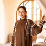 Buy a brown embroidered outfit online featuring a band collar, pleated front, baggy sleeves, and straight pants for an elegant, modern look.