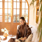 Buy a brown embroidered outfit online featuring a band collar, pleated front, baggy sleeves, and straight pants for an elegant, modern look.