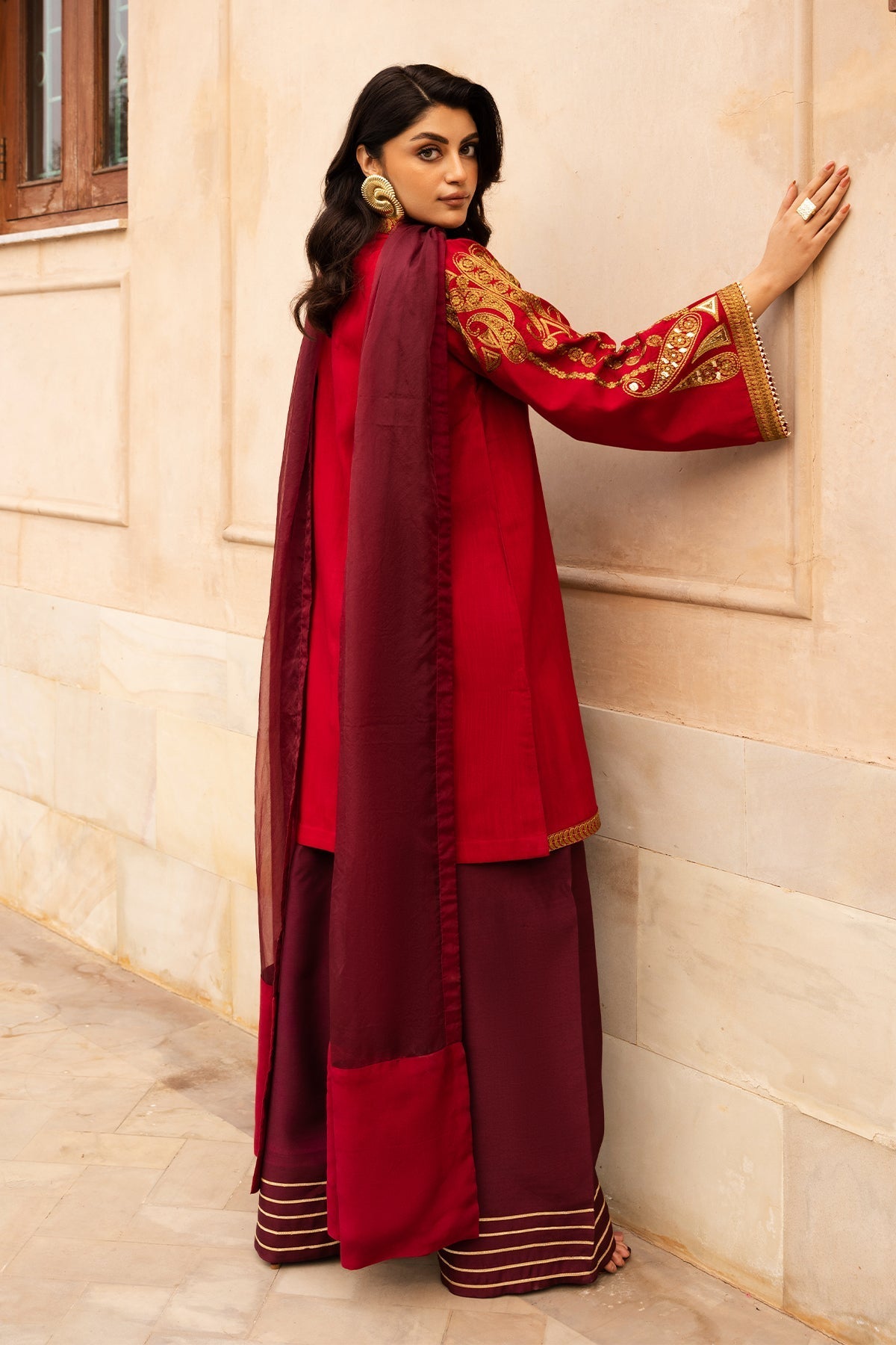 Aabroo embroidered raw silk party wear dress with organza dupatta.

