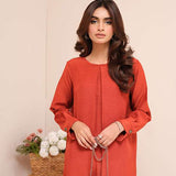 Carnelian rust raw silk suit with subtle pleats and a flowy silhouette