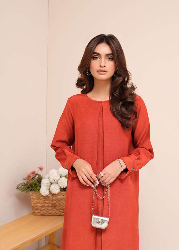 Carnelian rust raw silk suit with subtle pleats and a flowy silhouette