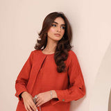 Carnelian rust raw silk suit with subtle pleats and a flowy silhouette