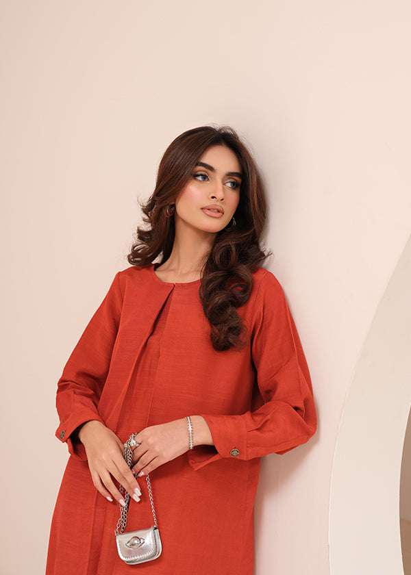 Carnelian rust raw silk suit with subtle pleats and a flowy silhouette