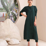 Buy an emerald green raw silk button-down shirt online with concealed buttons, delicate stitching, and elegant cuffs for a modern, refined look.