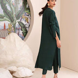 Buy an emerald green raw silk button-down shirt online with concealed buttons, delicate stitching, and elegant cuffs for a modern, refined look.