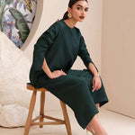 Buy an emerald green raw silk button-down shirt online with concealed buttons, delicate stitching, and elegant cuffs for a modern, refined look.