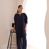  Sapphire blue crepe suit with a V-cut neckline and wide-leg pants