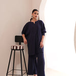  Sapphire blue crepe suit with a V-cut neckline and wide-leg pants